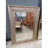 Rectangular bevelled mirror in decorated painted frame