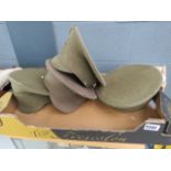 Box containing 4 olive green military caps