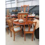 Circular pine coffee table plus 5 chairs, to include a single carver