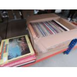 Box and a stack of vinyl records