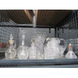 Cage containing sauce bottles, decanters, jugs and vases