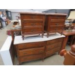 Continental serpentine fronted chest of six drawers with a marble surface, plus a pair of matching