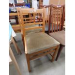 Pair of 1920's oak dining chairs with olive green seats