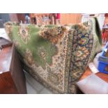 (1) 2.5 x 3.5 floral green woollen carpet
