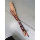 Bundle containing paddles, walking sticks and a modern Maori club