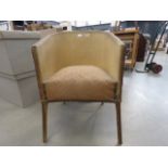 Gold painted lloyd loom style armchair