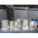 Cage containing quantity of pewter ale mugs