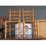 Pair of pine ladderback chairs with rush seats