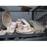 Cage containing floral patterned Staffordshire crockery, sundae dishes and sherry glasses