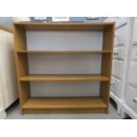 Oak finished open fronted bookcase