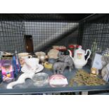 Cage containing horse brasses, ornamental figures, boxed teaspoon sets and commemorative ware