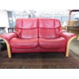 Stressless style red leather two seater sofa