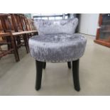 Grey fabric chair with circular seat