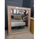Rectangular bevelled mirror in floral decorated frame