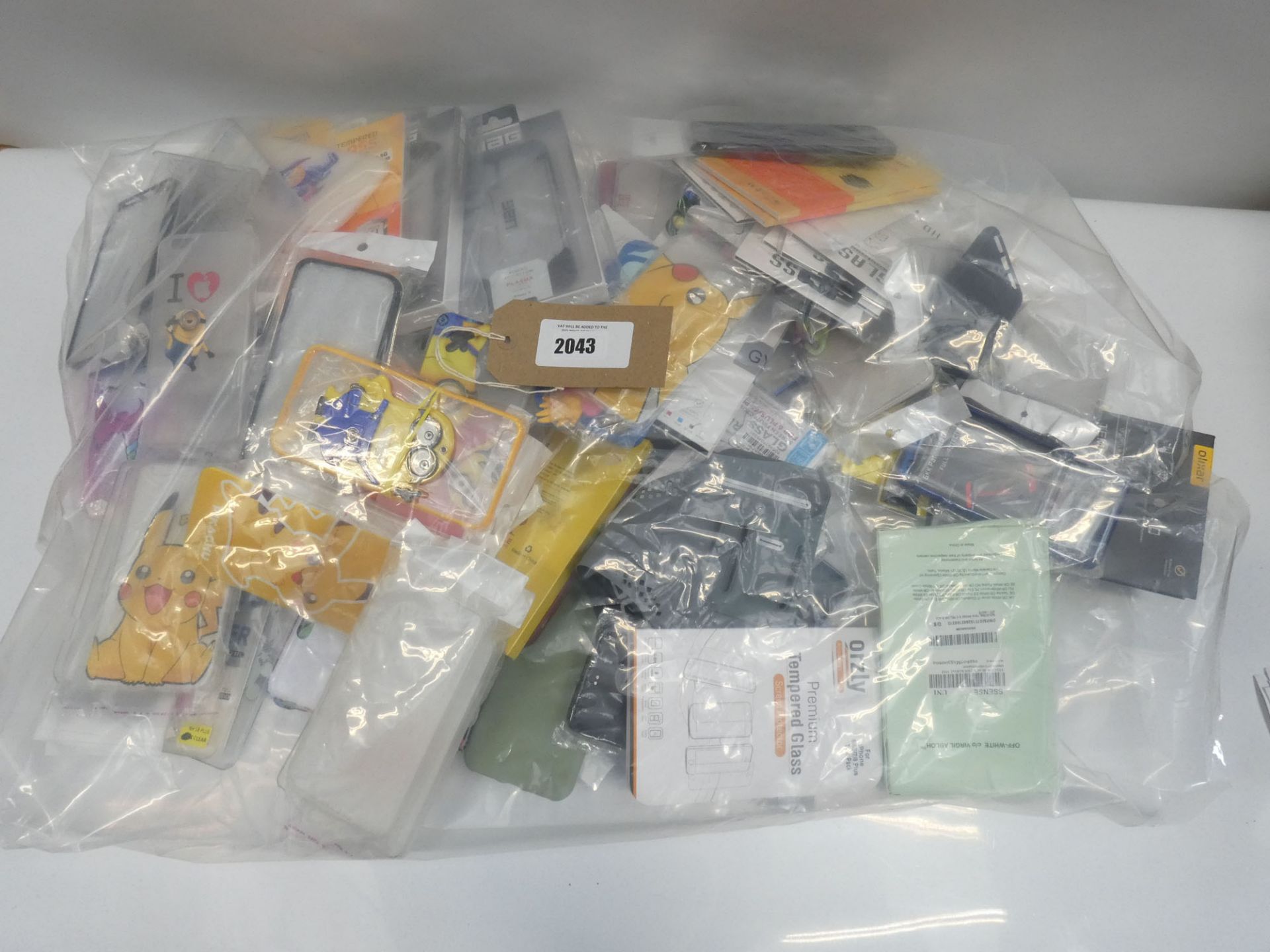 Bag containing quantity of mobile phone covers and cases