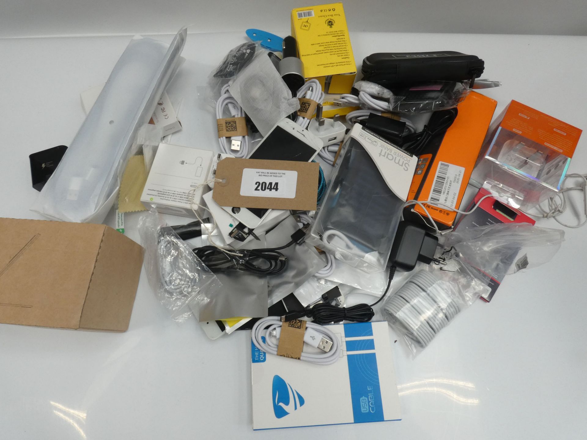 Bag containing quantity of mobile phone accessories; cables, leads, adapters