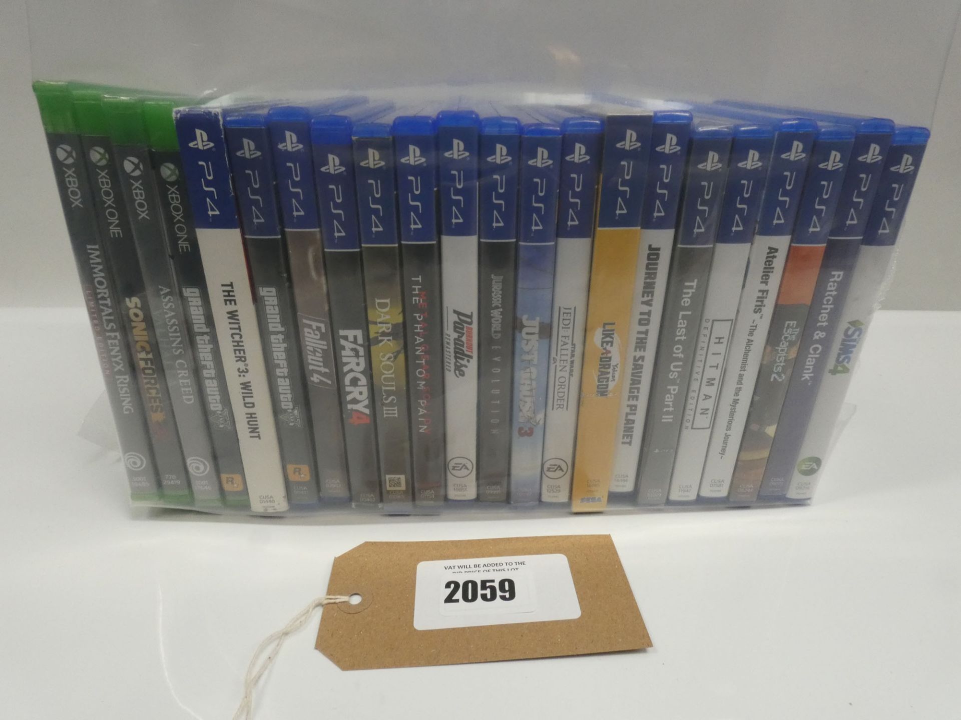 Bag containing 18x PS4 games and 4x Xbox One games