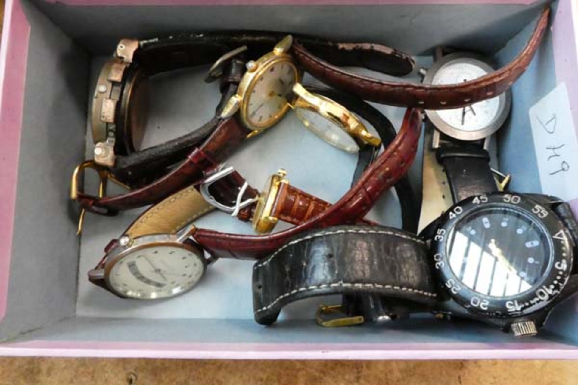 Tray containing a selection of quartz wristwatches, Olympus and various other unbranded watches