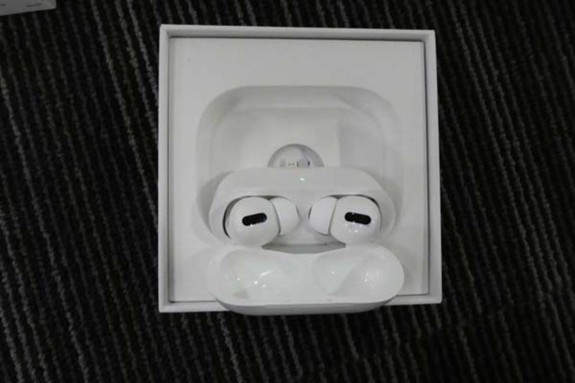 Boxed set of Apple Airpods Pro, with wireless charging case, charging cable and spare air tips
