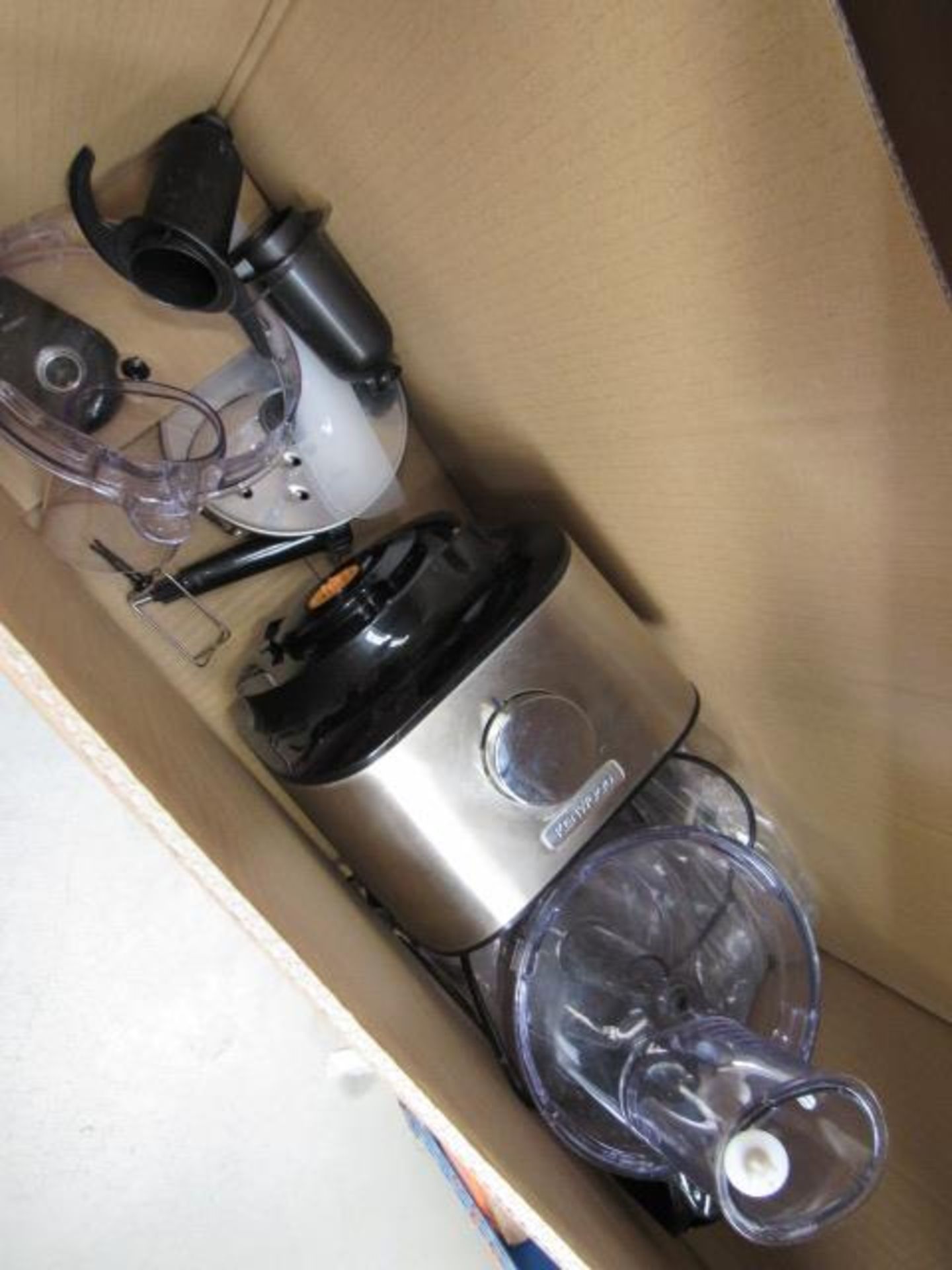 Box containing a Kenwood mixer/food processor with attachments