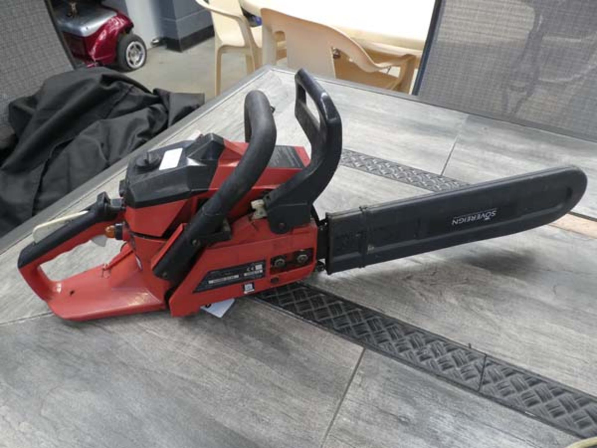 Sovereign red petrol powered chainsaw