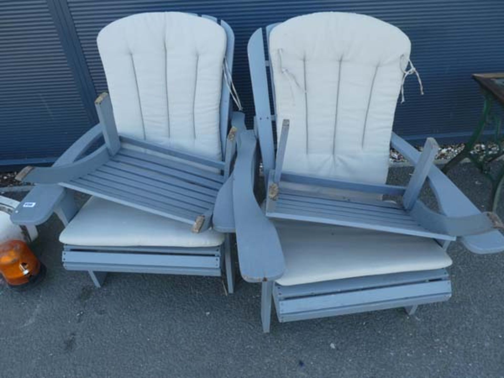 2 grey chairs and footstools