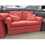 Red floral 2 seater sofa