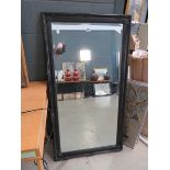 Rectangular bevelled mirror in black painted frame