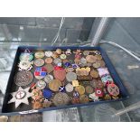 Tray with a quantity of medals and badges