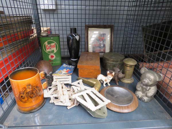 Cage containing: metal Roman numerals, Castrol Oil tin, Lifebuoy advertising print, wooden box