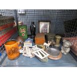 Cage containing: metal Roman numerals, Castrol Oil tin, Lifebuoy advertising print, wooden box