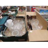 2 boxes containing glassware and 2 ornamental cart horses