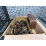 Cage containing: vintage camera metal buckles, handles, die-cast car, razor blades, pens and