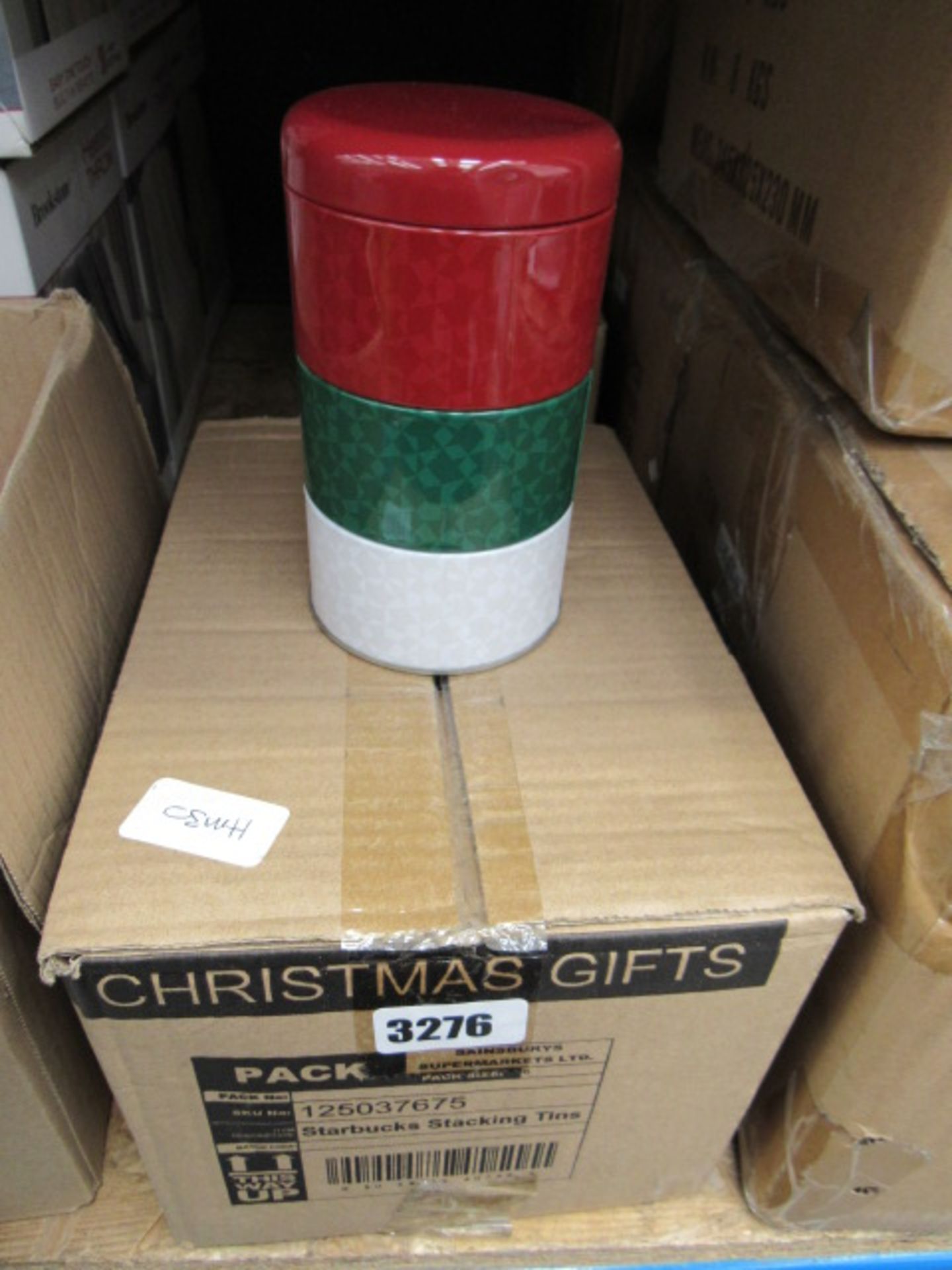 Box containing 6 stacking Starbucks tins