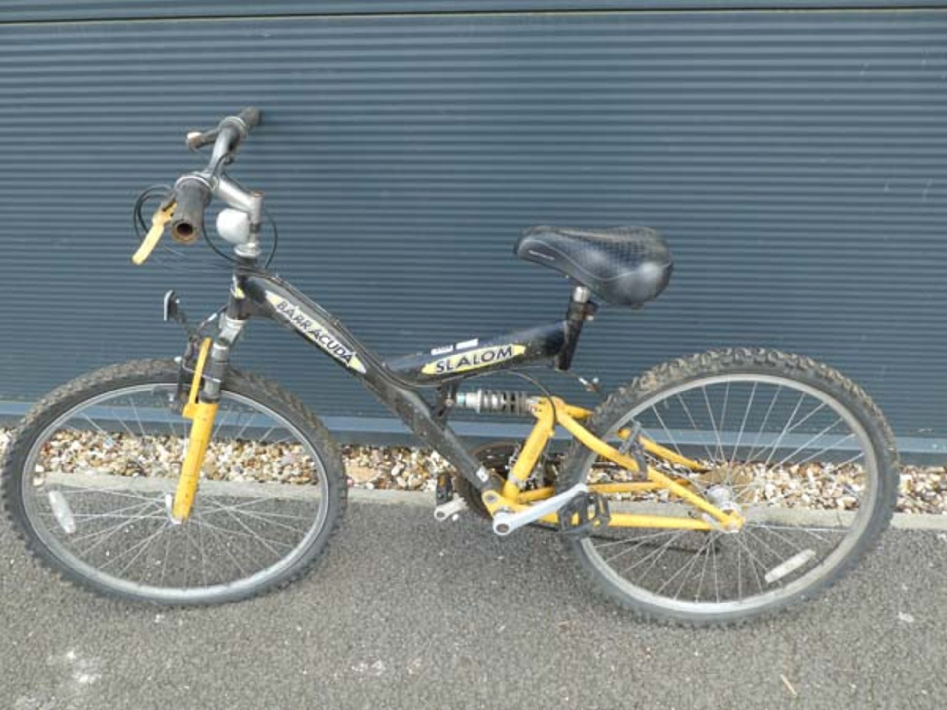 Black and yellow childs suspension mountain bike