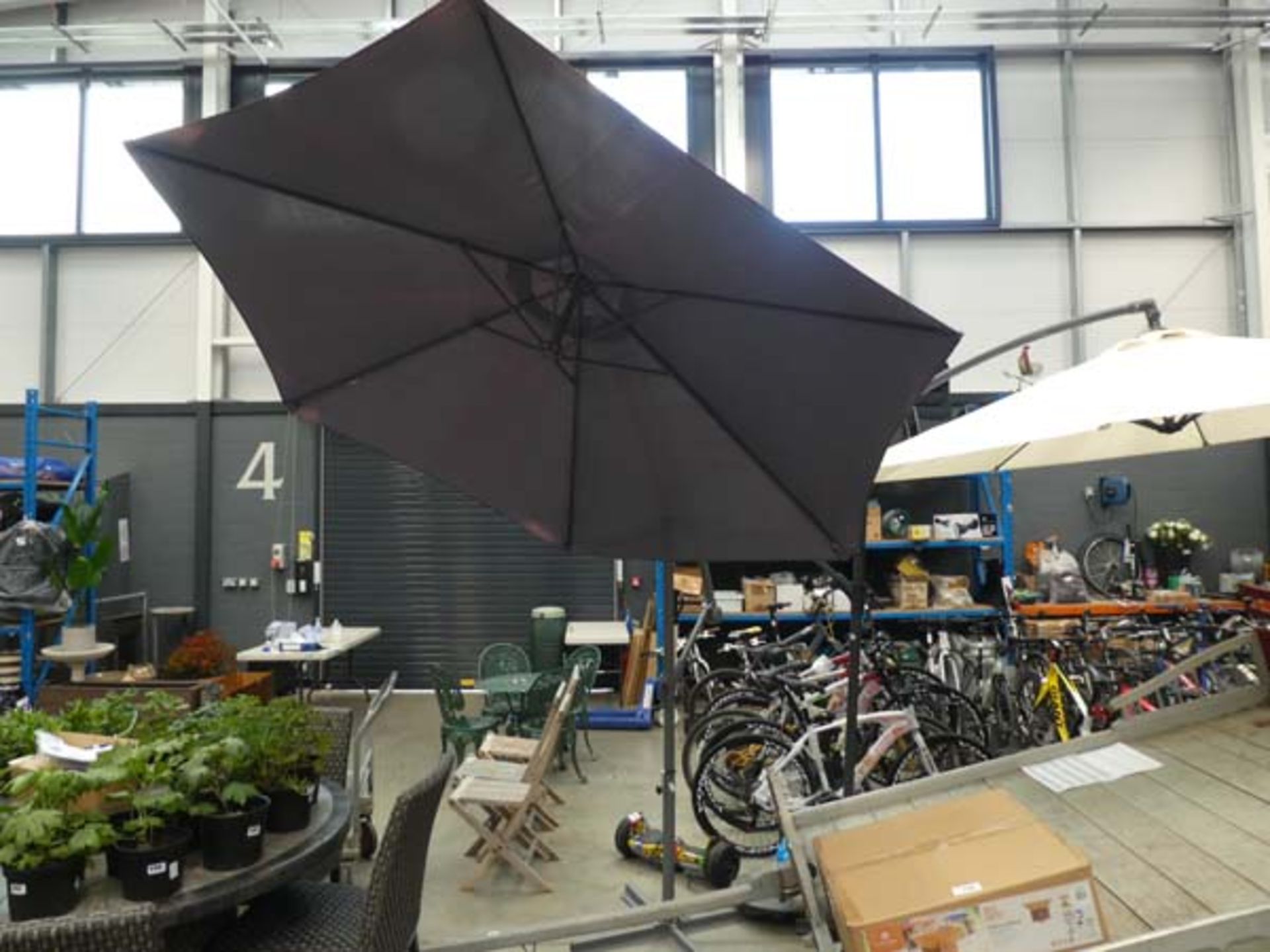 Grey cantilever umbrella with stand