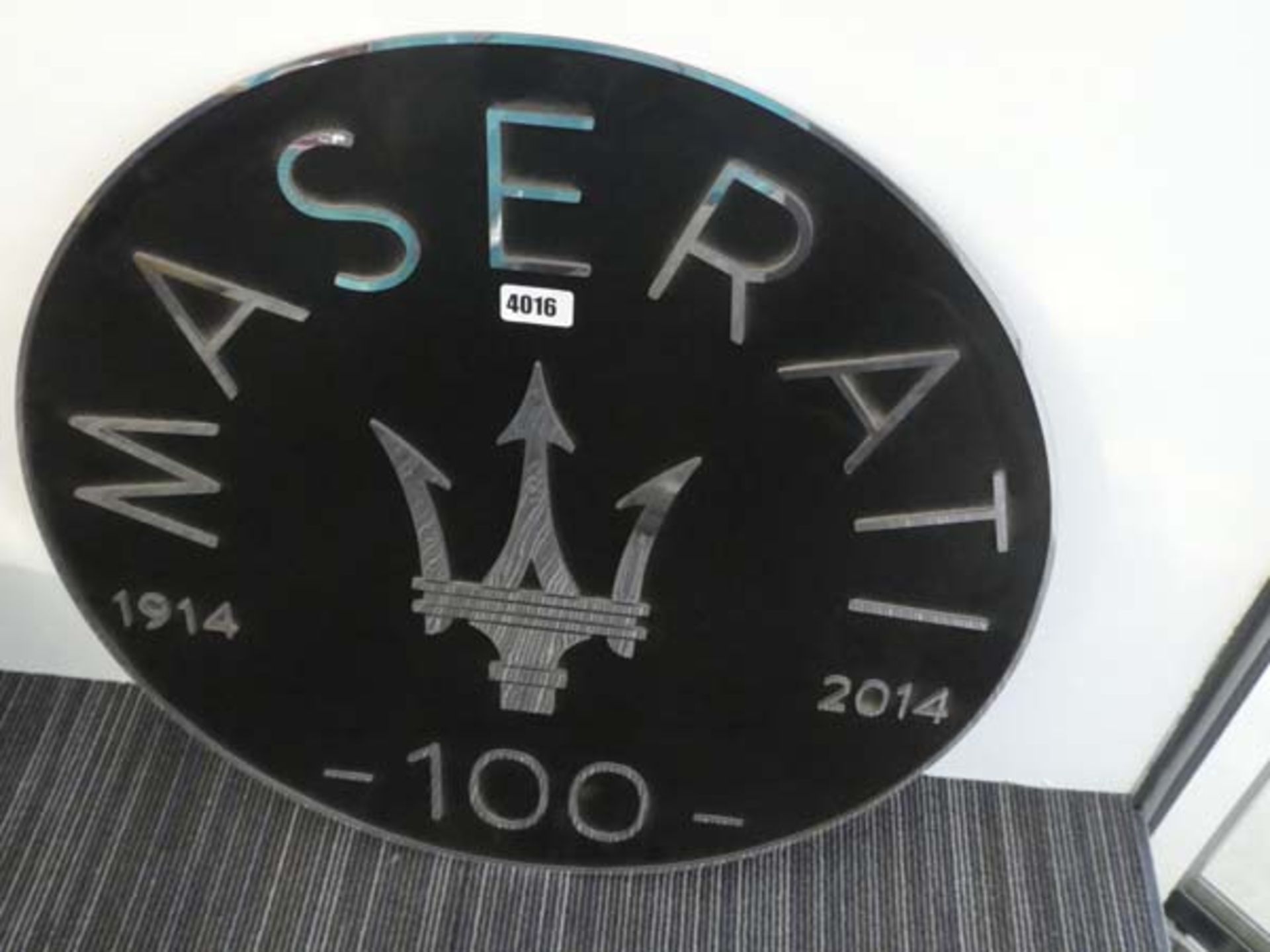 A 1914-2014 Maserati '100 Years' wall sign, di. 61 cm