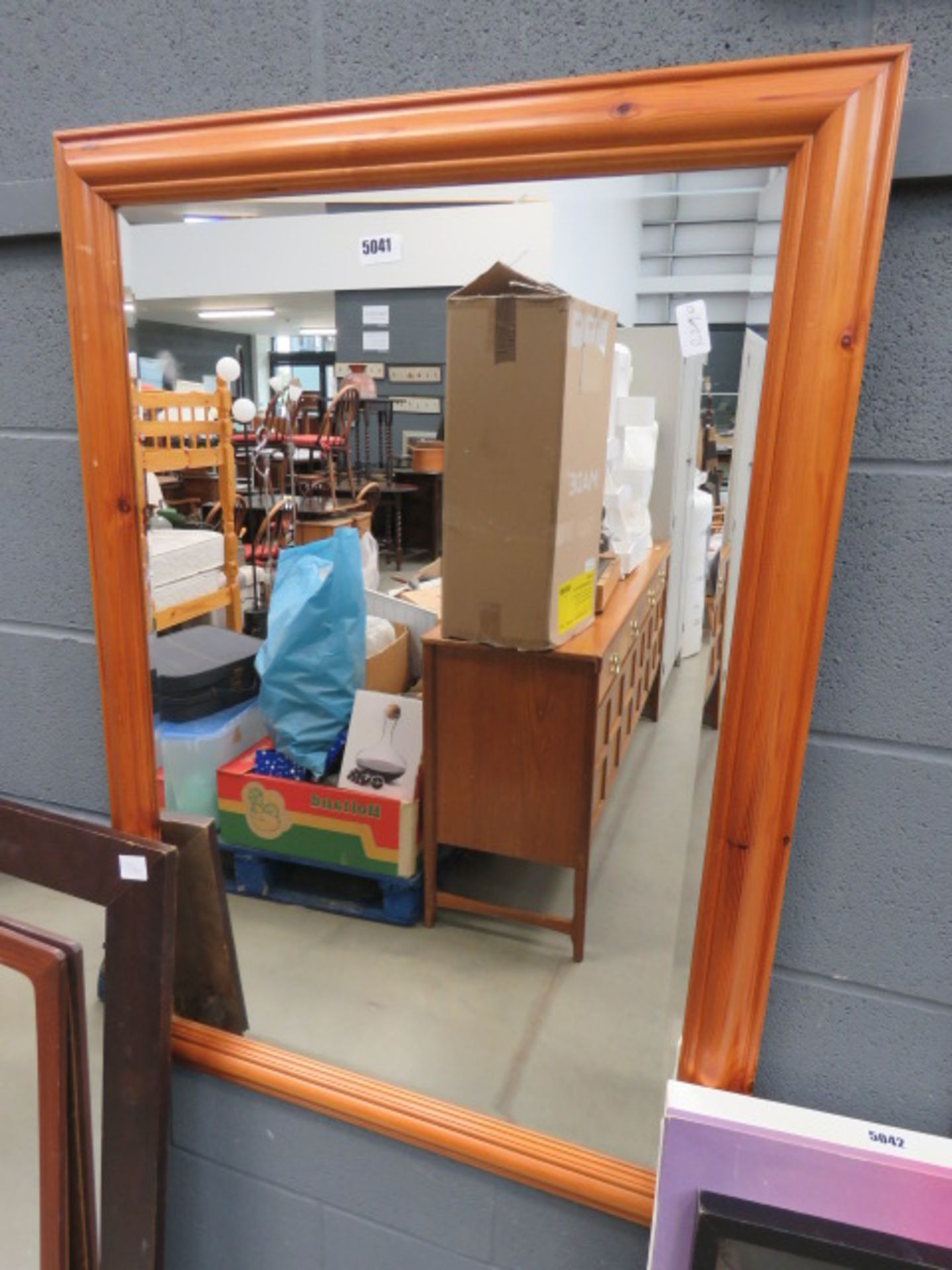 Rectangular bevelled mirror in pine frame