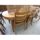 Oval teak extending dining table and 4 ladder back chairs Collector's item: see Soft Furnishings