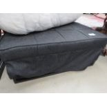 Grey fabric guest bed