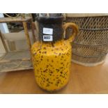 Orange glazed studio pottery jug Height: 40cm width: 20cm Chip to base