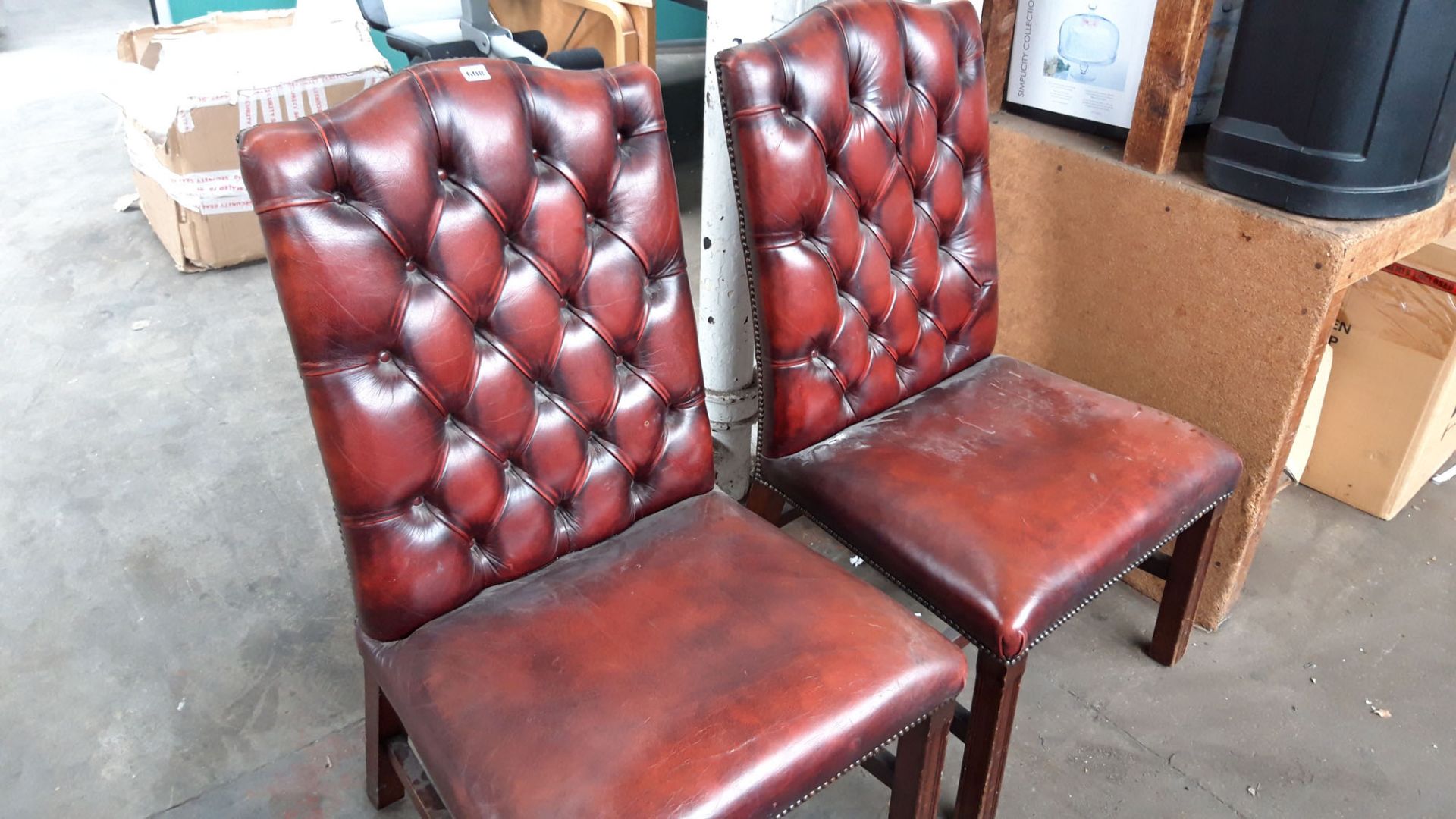 2 leather effect Burgundy button back chairs