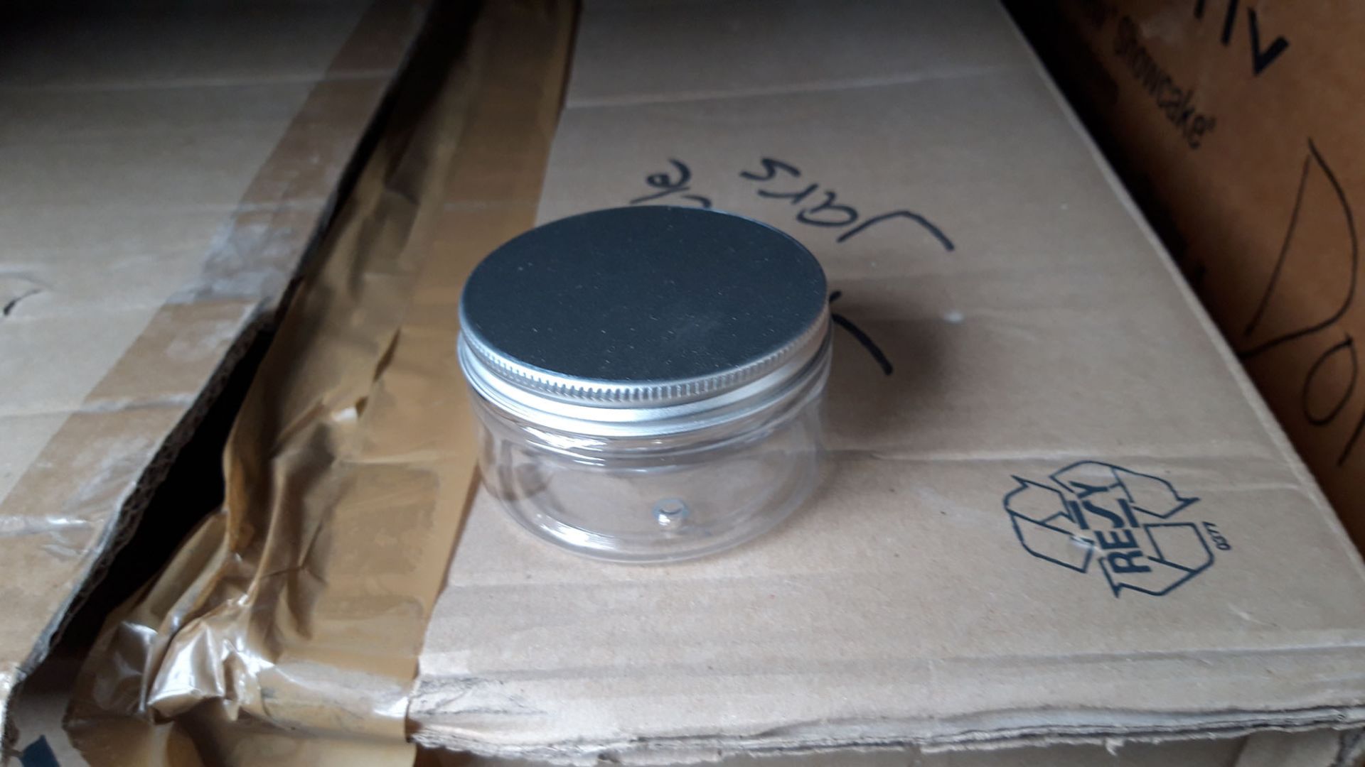 Box of small sprinkle jars