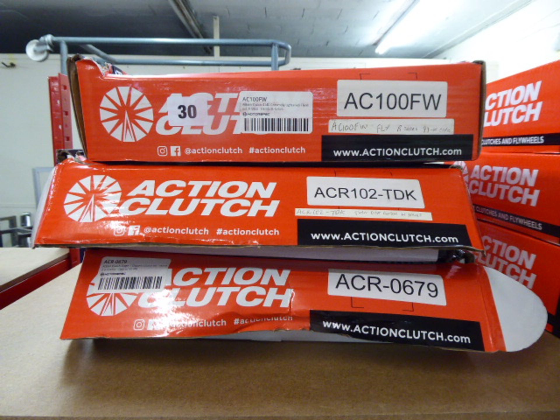 Three assorted Action Clutch fly wheels and clutch kits