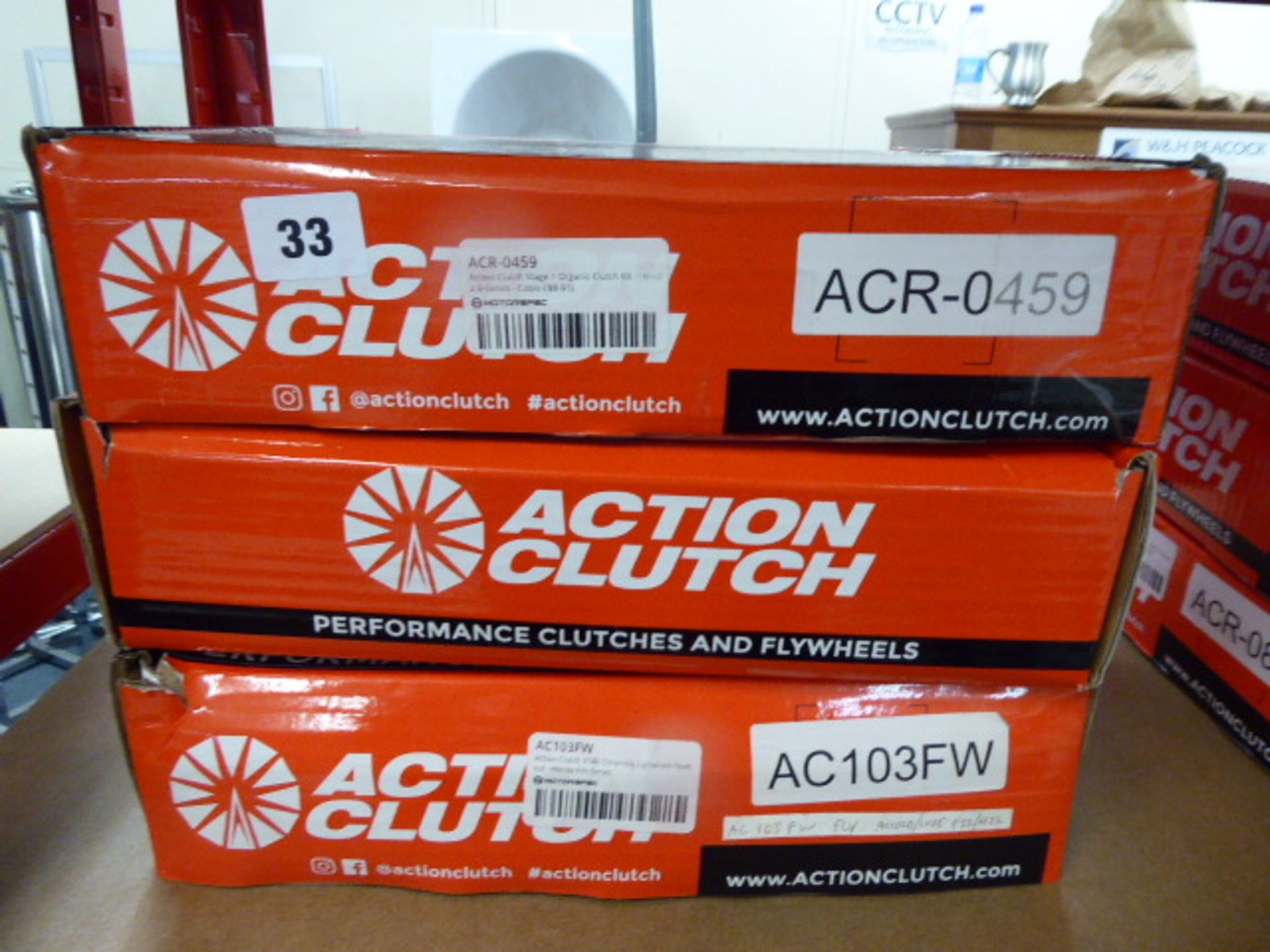 Three assorted Action Clutch fly wheels and clutch kits