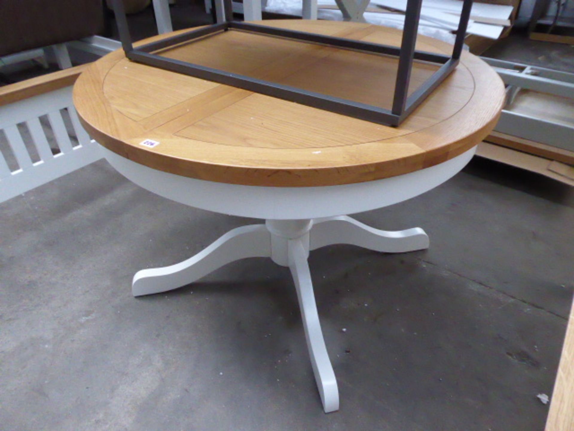White painted oak topped extending dining table, 110cm diameter