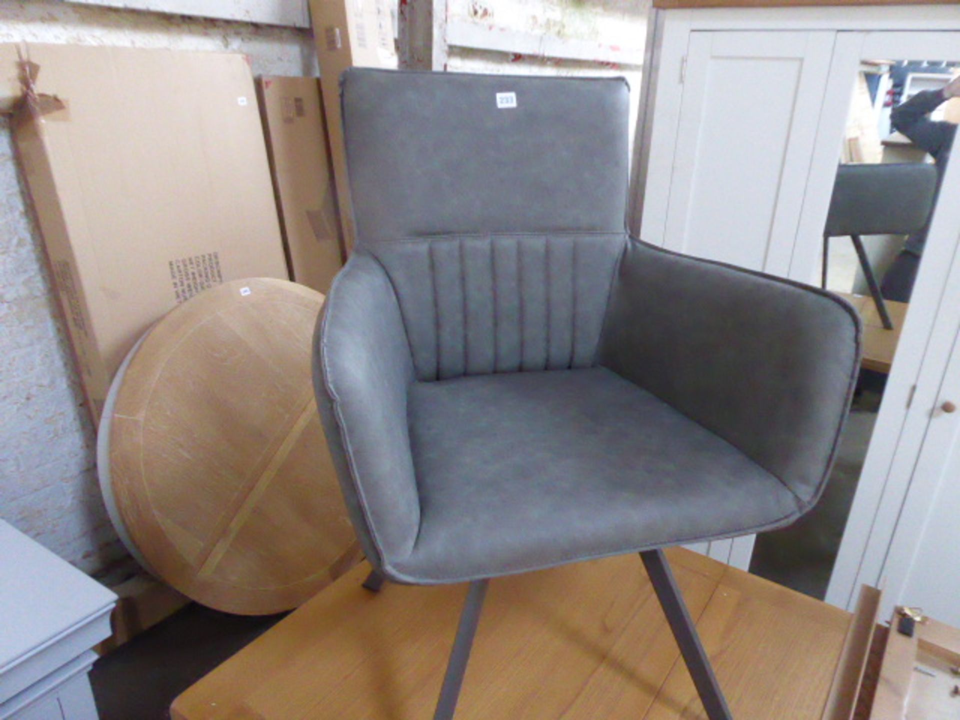 Grey leather effect tub chair on metal legs