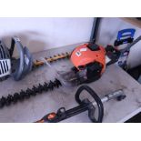 Orange petrol engine hedge trimmer