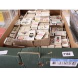 Box containing various themed cigarette cards incl. animals, trains, flowers, etc.