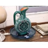 Single handled green glazed jug and blue glass dish